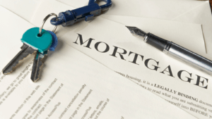 Mortgage documentation with keys and pen on it