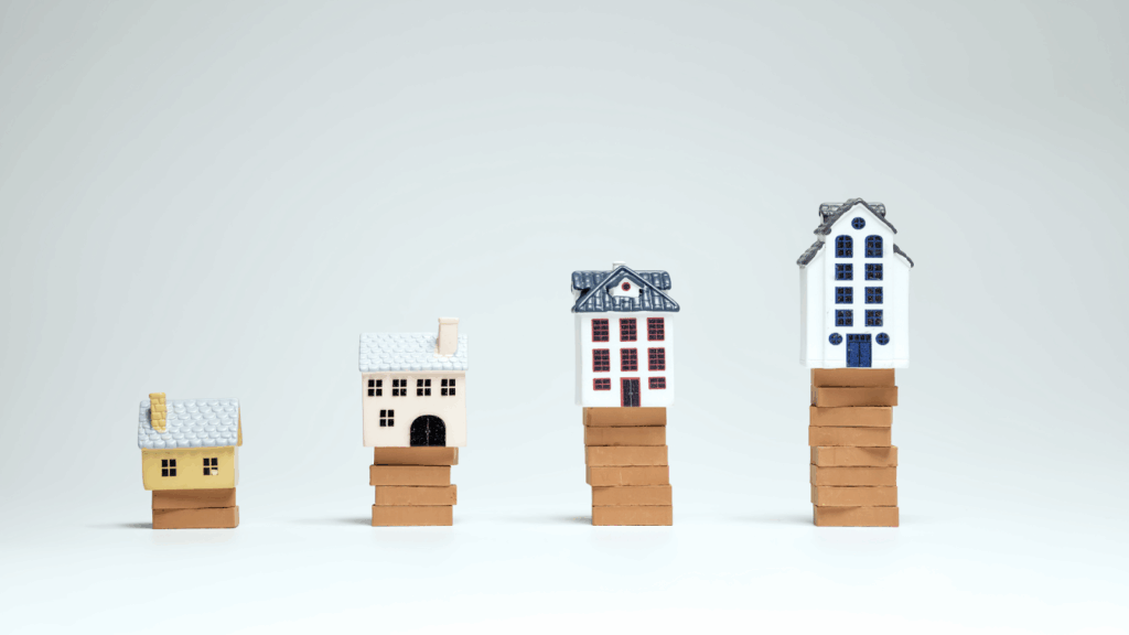 Miniature houses symbolizing growth of real estate market
