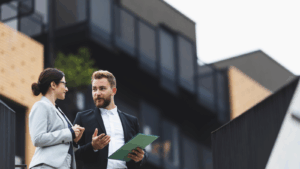 Tax professionals outside a property after assessing its value