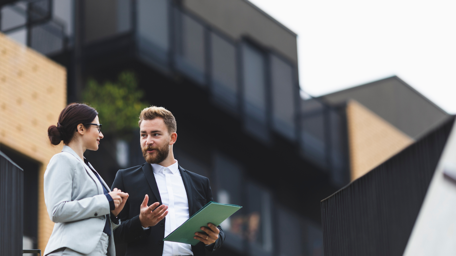Tax professionals outside a property after assessing its value