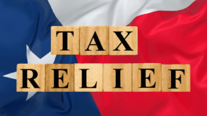 Tax Relief on wooden blocks with Texas Flag background