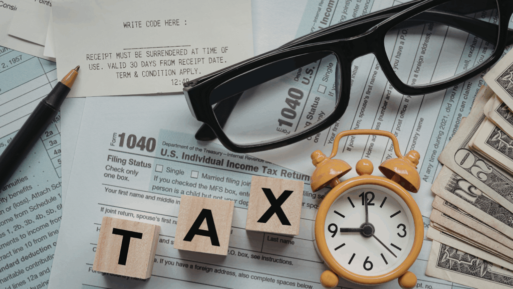 Necessary tax items with alarm clock symbolizing deadline