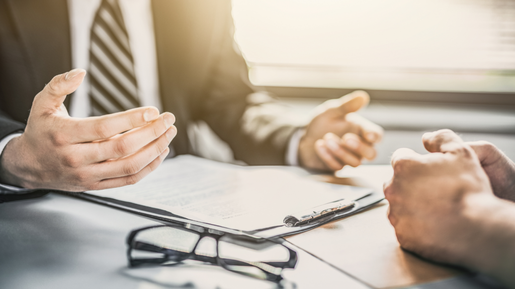 Tax adviser explaining to client the consequences of not paying tax on time