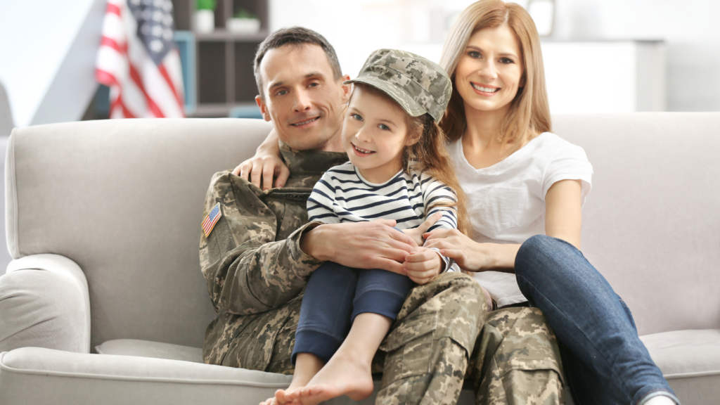 A happy veteran and family who may qualify for property tax exemption