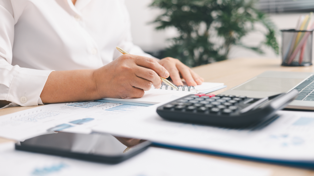 Consultant calculating percentage adjustments for property tax comparable valuations