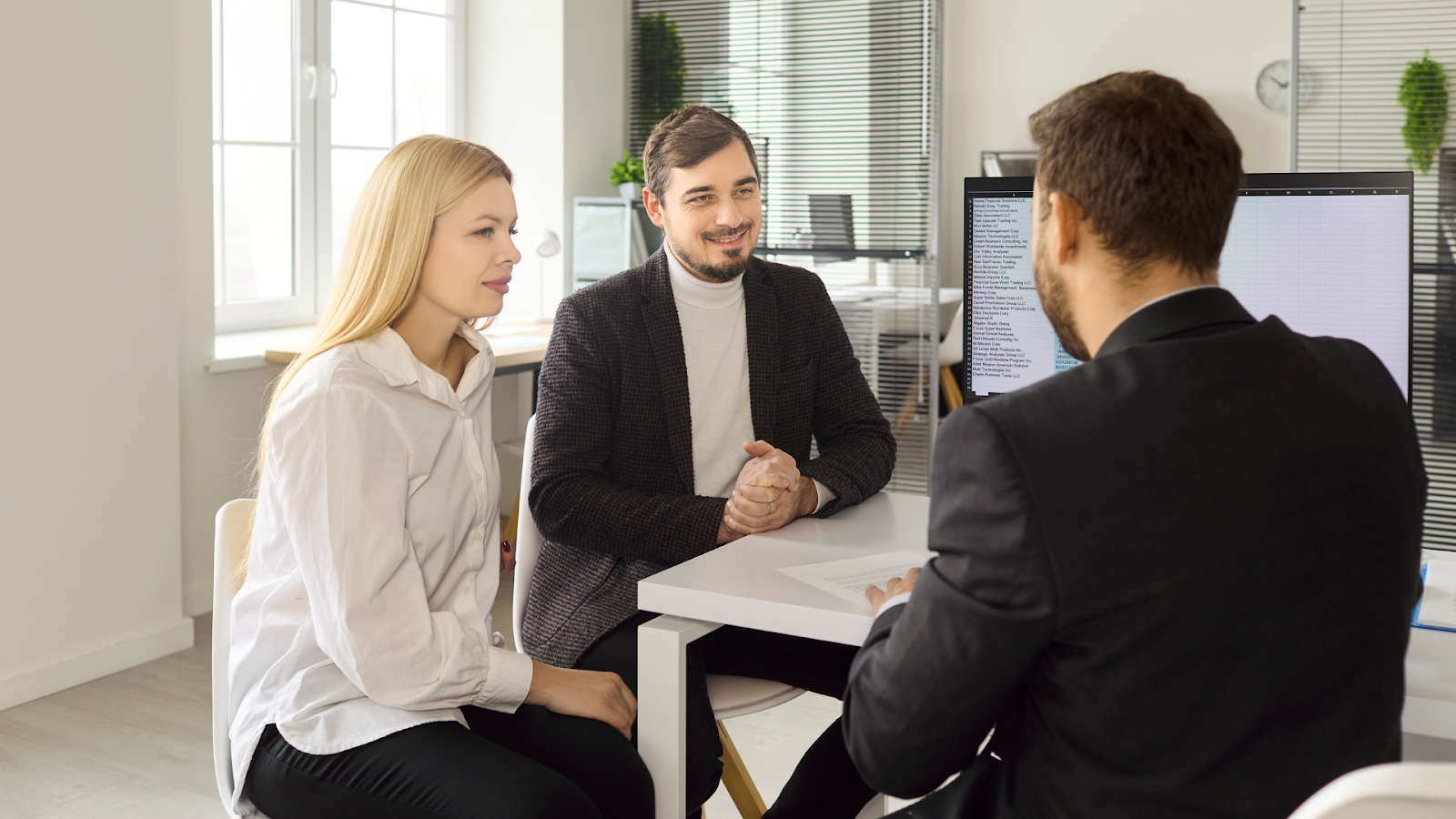 Homeowners consulting a tax professional to win a property tax protest