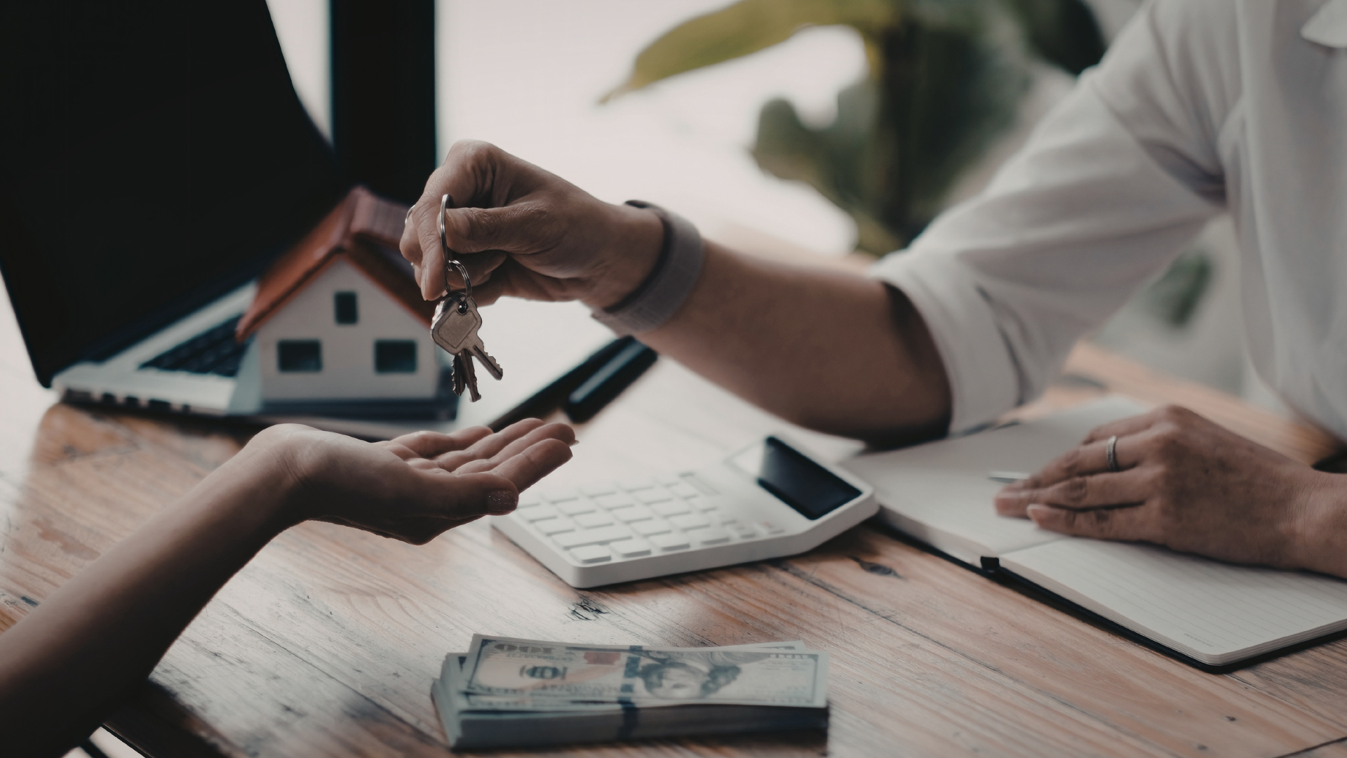 First time Houston buyer receiving keys following successful home purchase