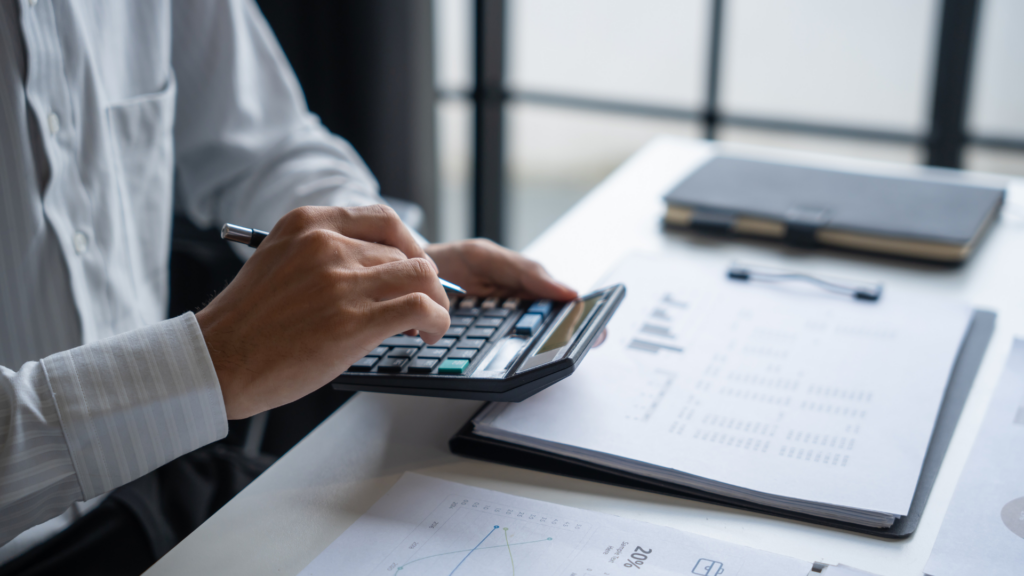 Consultant reviewing financial documents to assess capital loss tax offset options