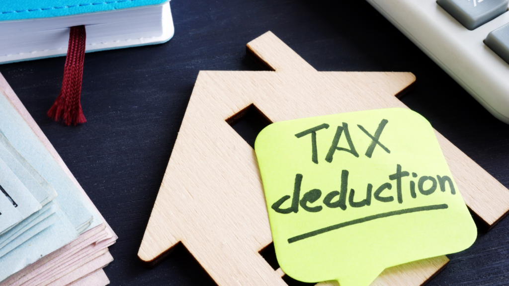 House-shaped figure paired with a tax deduction reminder note