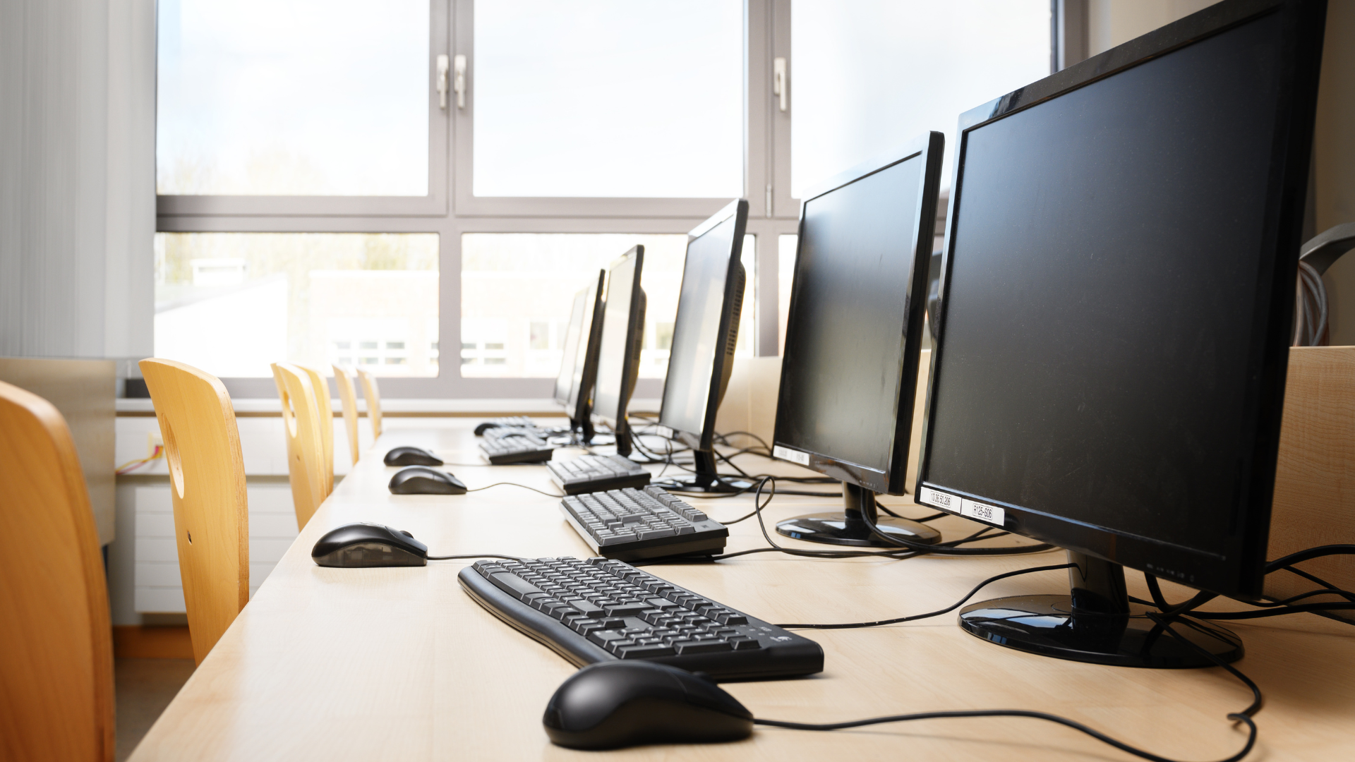 Row of monitors illustrating taxable business technology assets